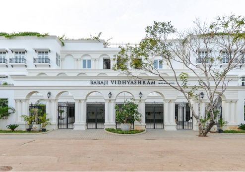 A longshot of Babaji Vidyashram School Front in daylight