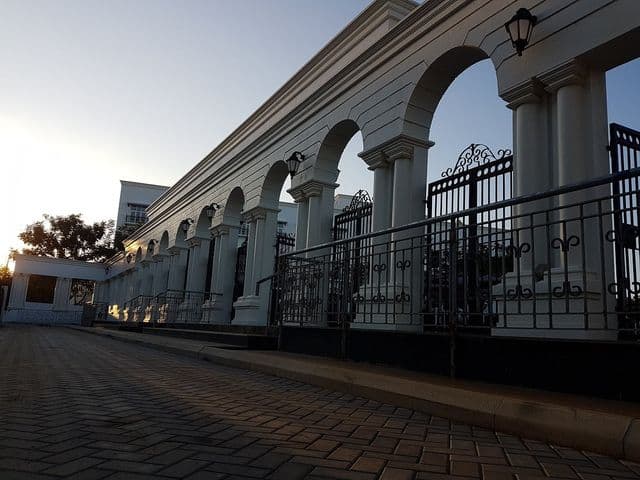 The front entrance of Babaji Vidyashram School in Chennai, having arched columns and tastefully designed grilles for protection.