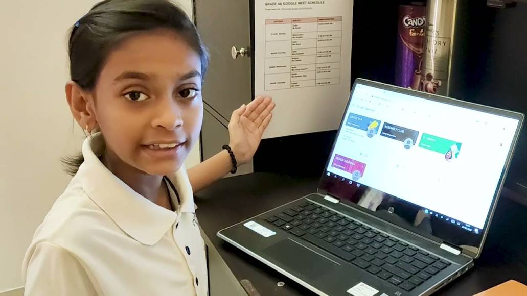 A BVS girl student working with laptop.